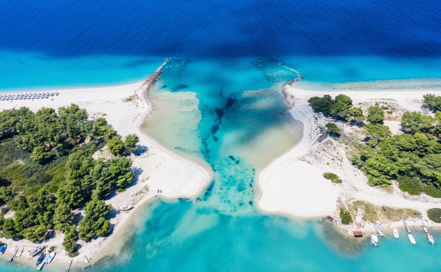 Aerial drone view of Port Glarokavos and lagoon beach in Kassandra penisula Chalkidiki Greece