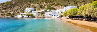 Azure sea and sandy beach in Platis Gialos village, Sifnos island, Greece